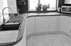 Hand crafted walnut worktops show off the curves in the kitchen we installed in this kitchen enlargement project.