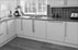 Three existing rooms were knocked through to become a large open plan kitchen with solid oak flooring. 